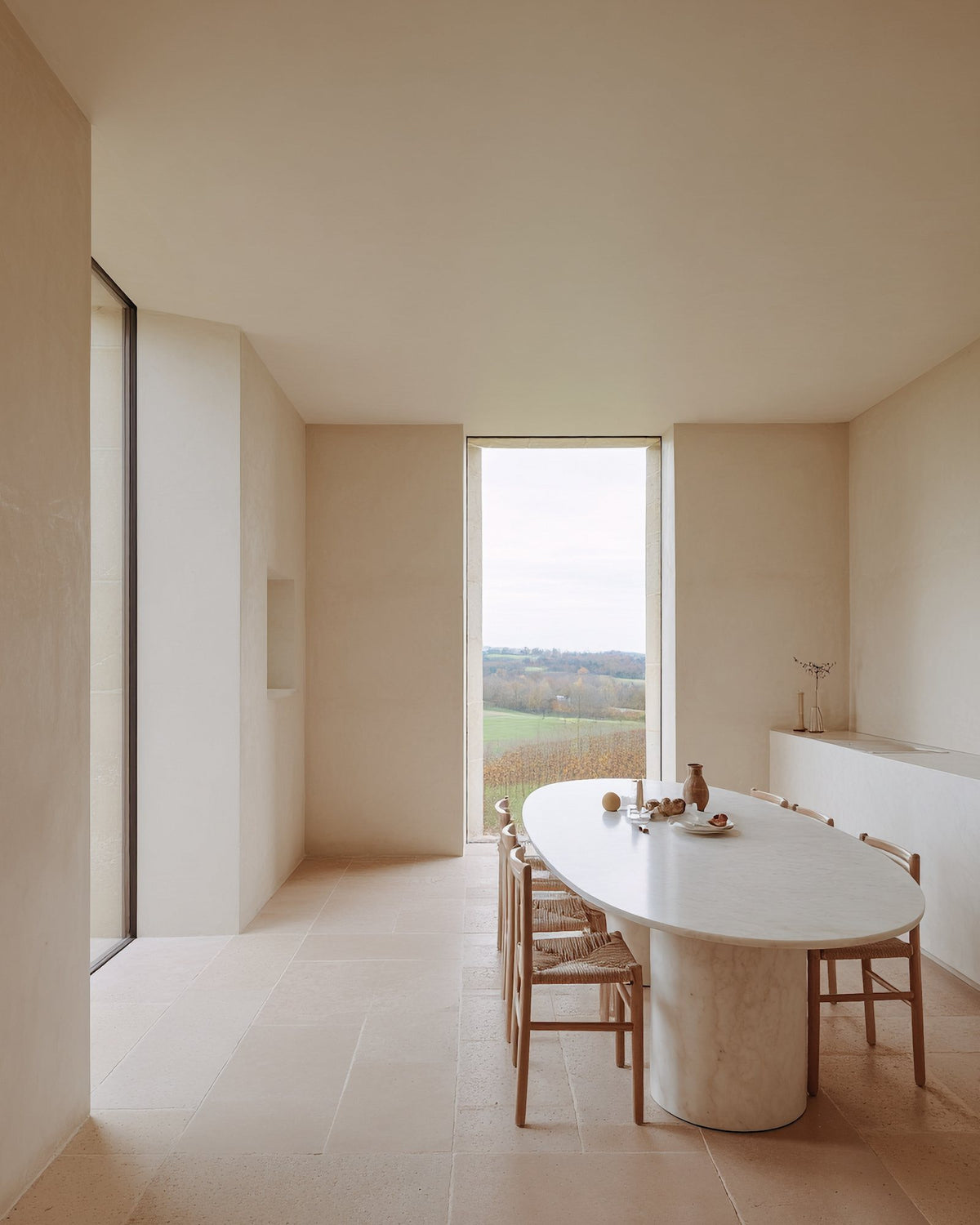 A dining room finished in Bauwerk Colour Dream limewash, showing it's neutral tone beauty | © Bauwerk Imagined