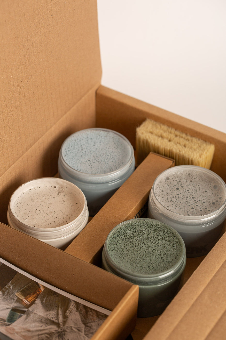 Open Kitchen Garden Garden Pot Paint Collection box with four 250ml limewash paint pots in soft green and warm neutral tones, a natural bristle brush and inspiration card. | © Bauwerk Colour